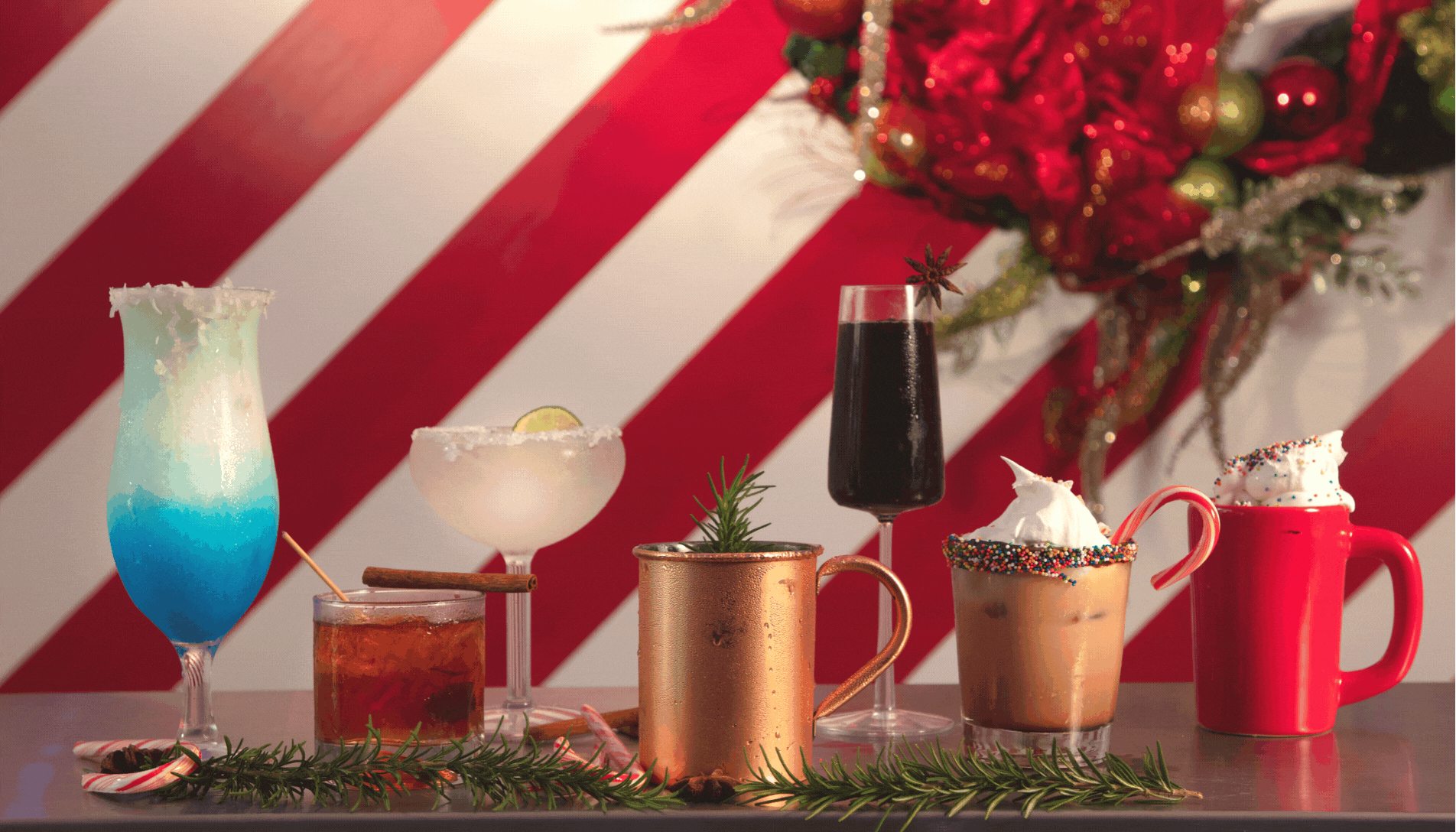 Rotation of holiday drinks, family in Christmas themed pop up bar and room.